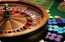 Roulette wheel and a stack of casino chips (Springbok artwork)